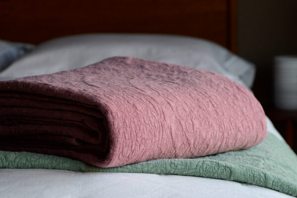 stonewash effect stitched and quilted bedspreads in wine red and sage green