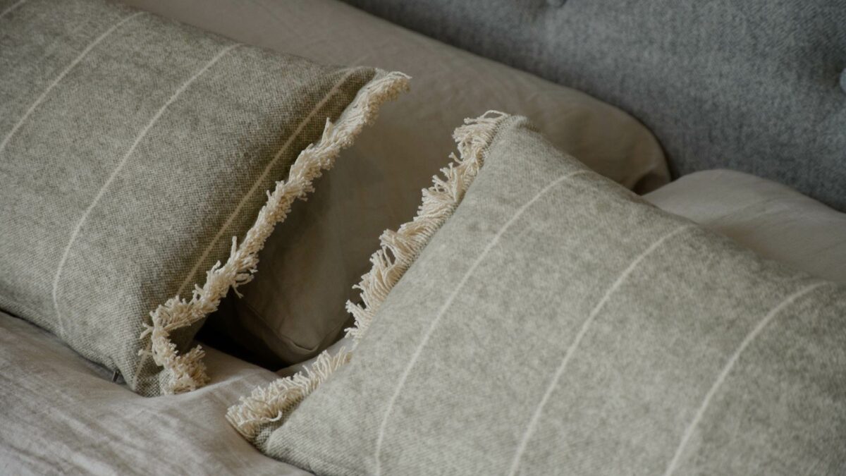 soft touch rectangular fringed cushions in olive green and cream