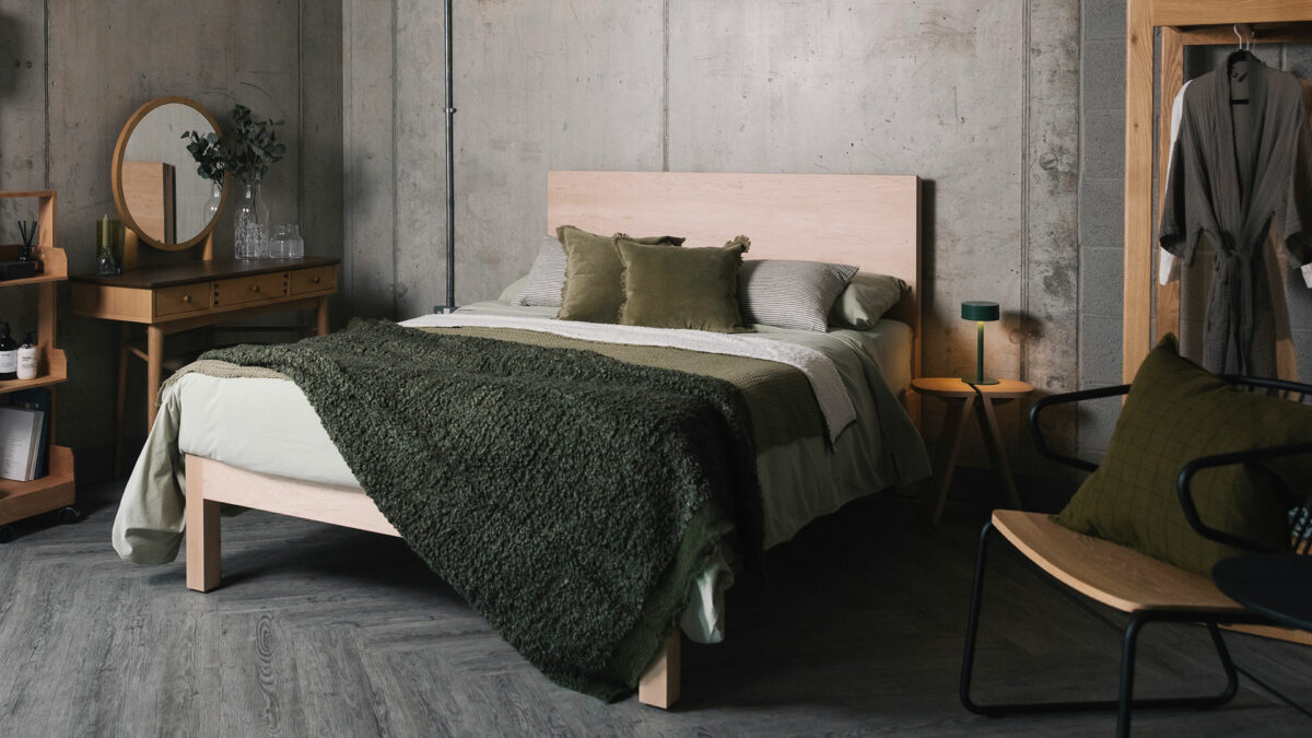 green stonewash bedding and green boucle throw on maple Bamford bed