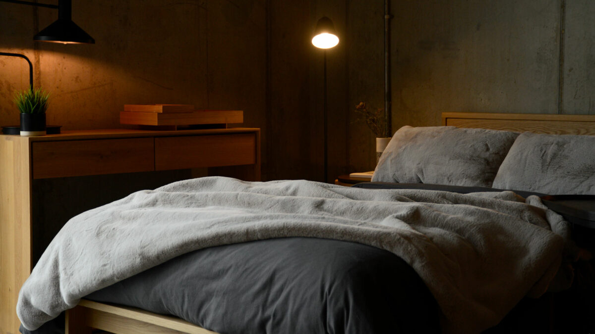 greige blanket and cushions