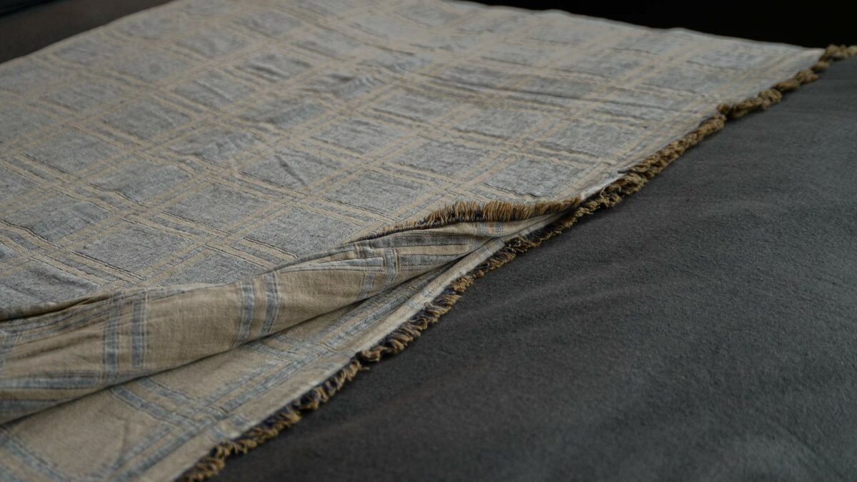 grey and beige double check throw