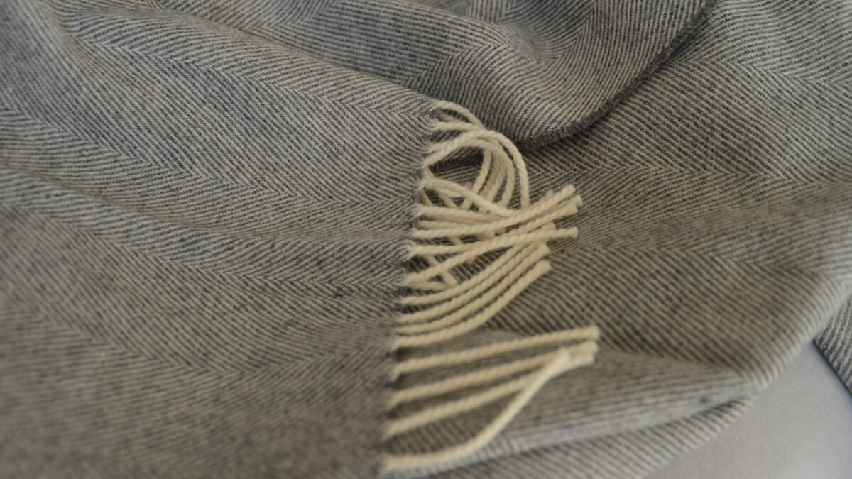 pure merino herringbone throw in grey and cream