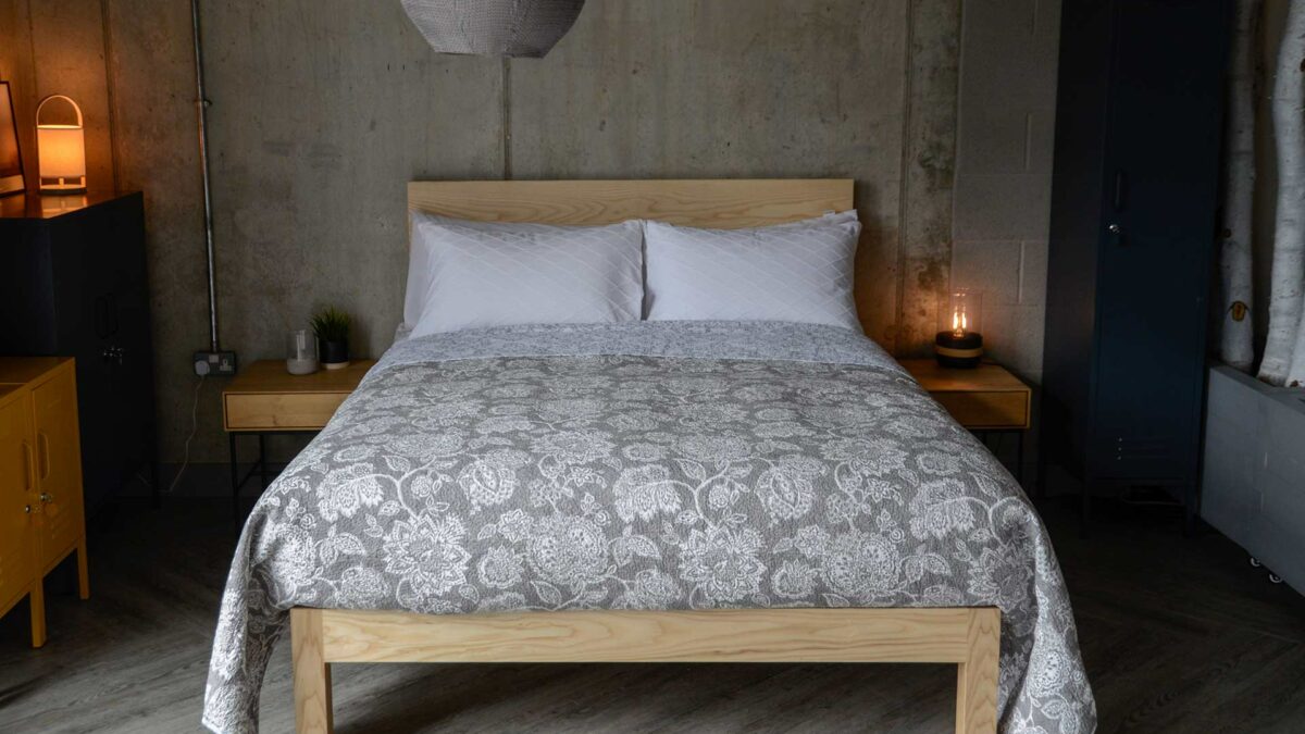 grey and white floral print quilted bedspread