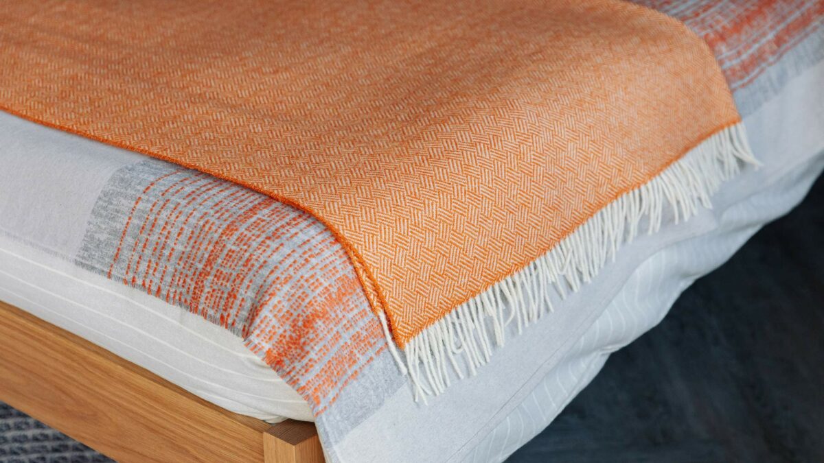 grey and deep orange bedding