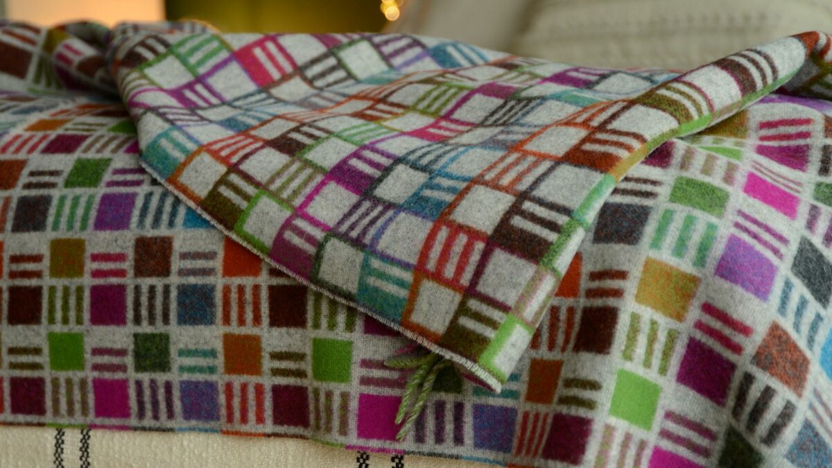 reversible graphic patterned merino wool throw in multicolours and grey