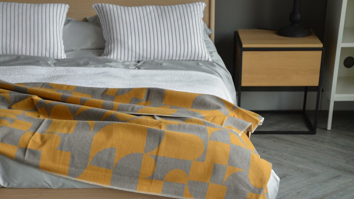 grey and mustard throw
