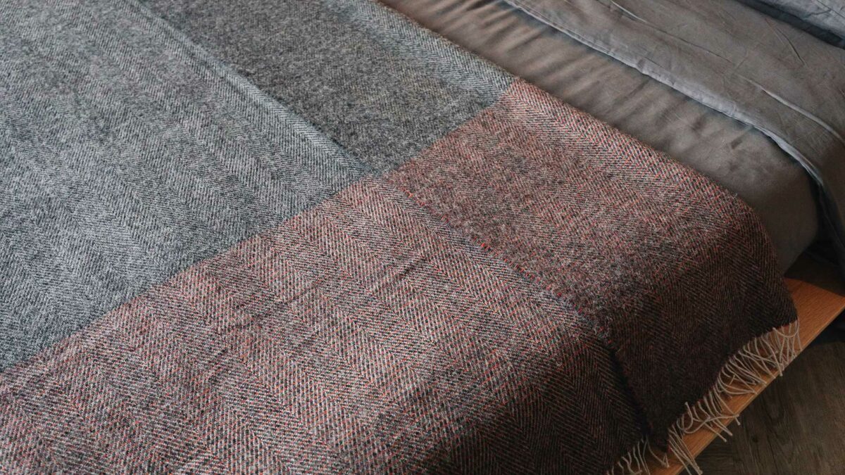grey and orange herringbone throw