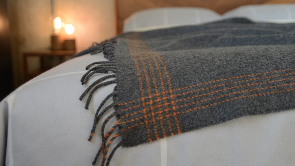 grey-and-orange-striped-throw in merino and cashmere