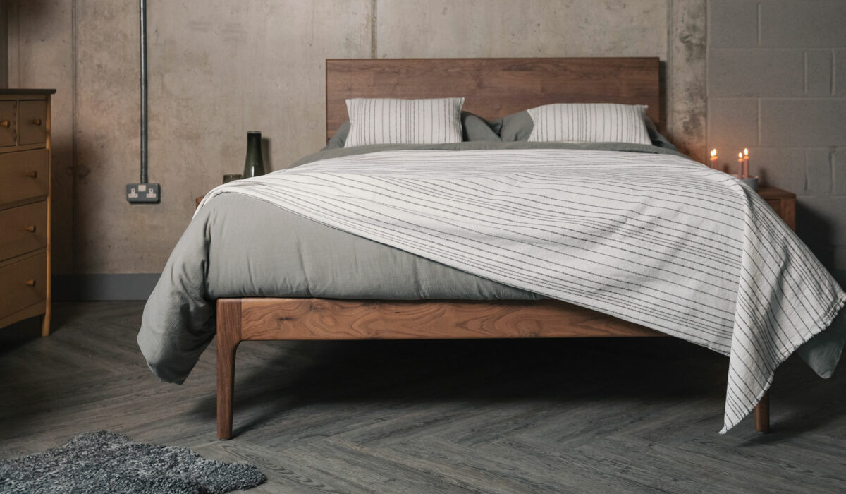 Chiswick a hand crafted solid wooden bed with taller headboard here made from walnut