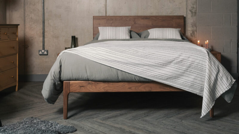 grey and white striped bedding on walnut Chiswick