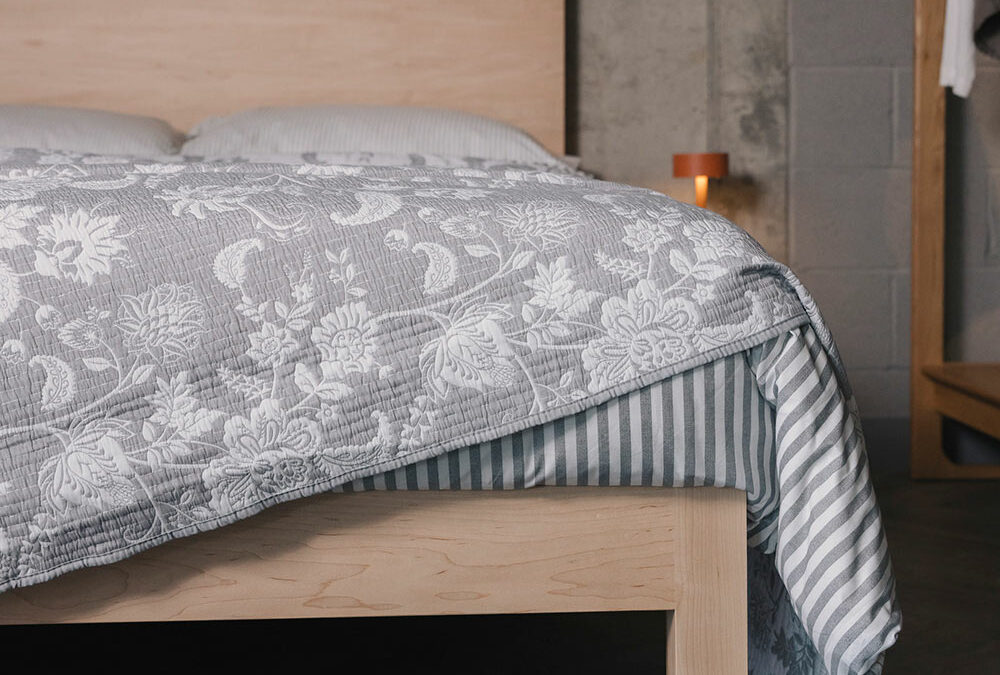 grey bedding on maple Bamford bed portrait