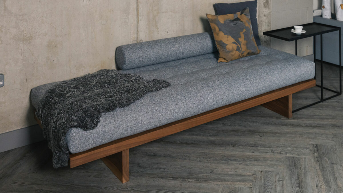 grey day bed with short haired sheepskin