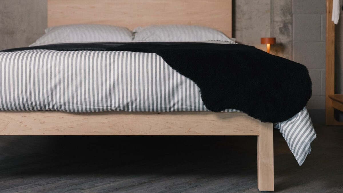grey striped duvet set and black sheepskin