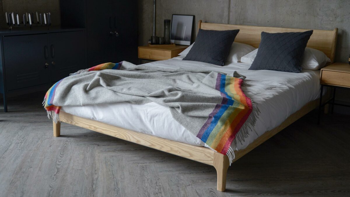 grey throw with multicolour edge on Carnaby bed