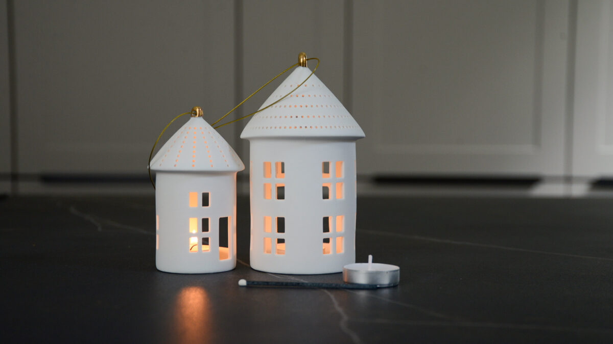 House shape matt porcelain hanging tea light lanterns with the candles lit