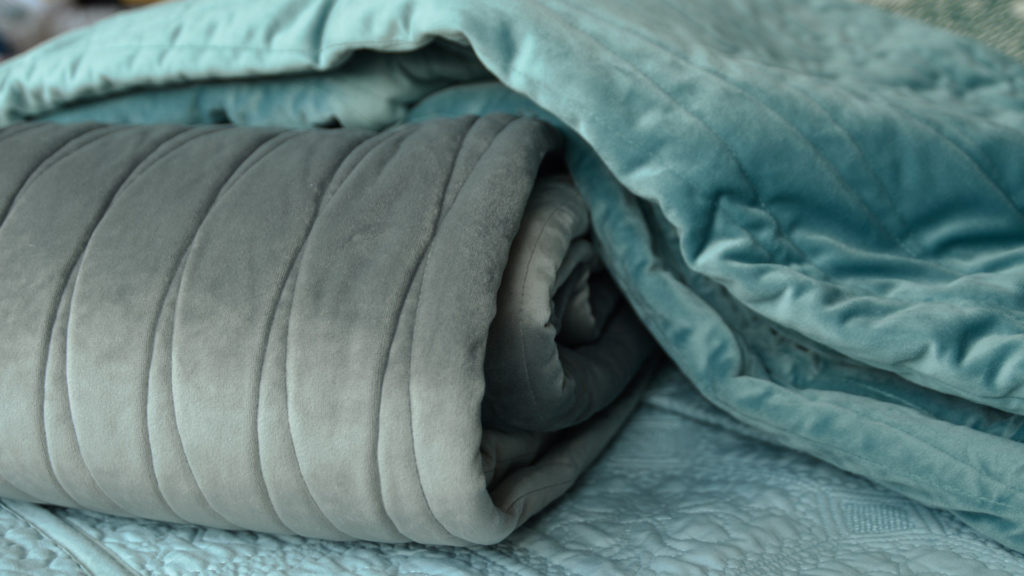 Grey and teal embroidered, velvet look quilts