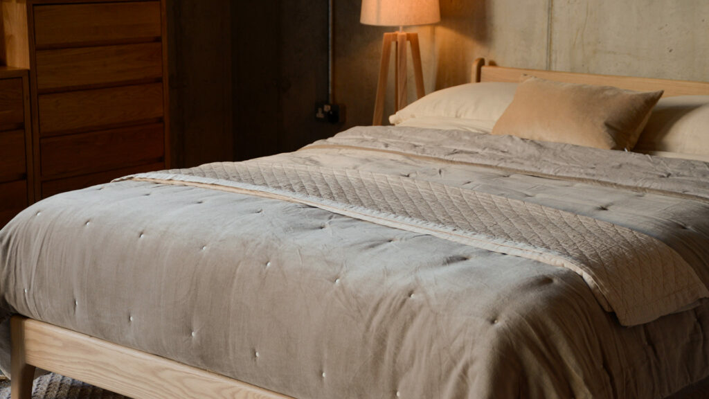 hazelnut velvet bedspread and deep cream throw
