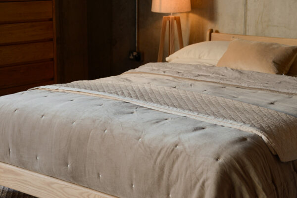 hazelnut velvet bedspread and deep cream throw