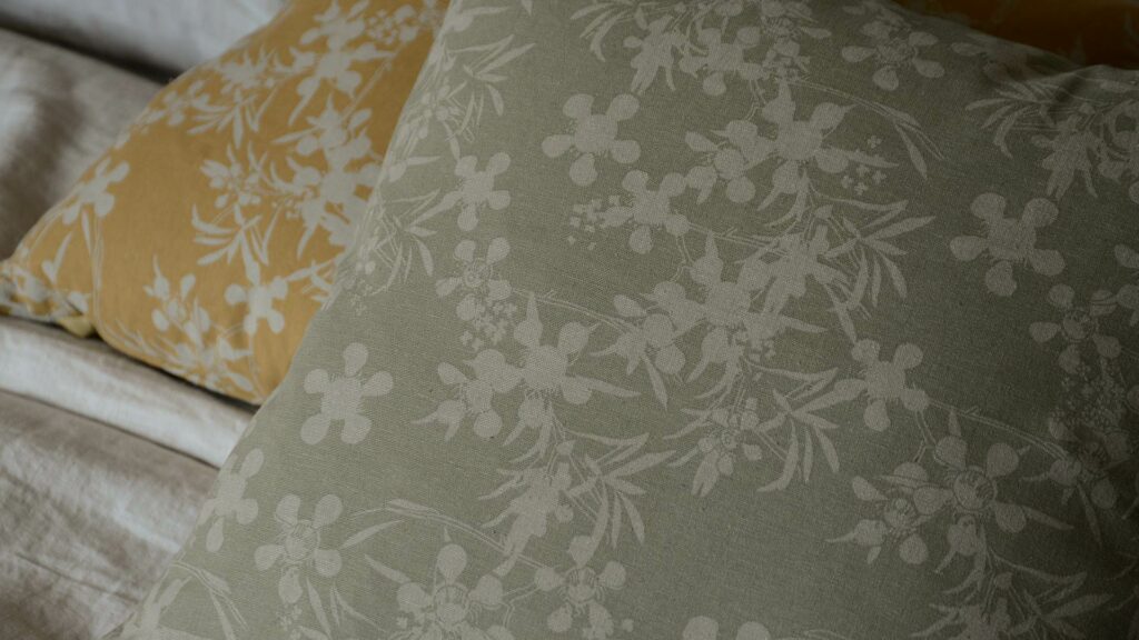 floral print cushions in a choice of sage green or deep yellow