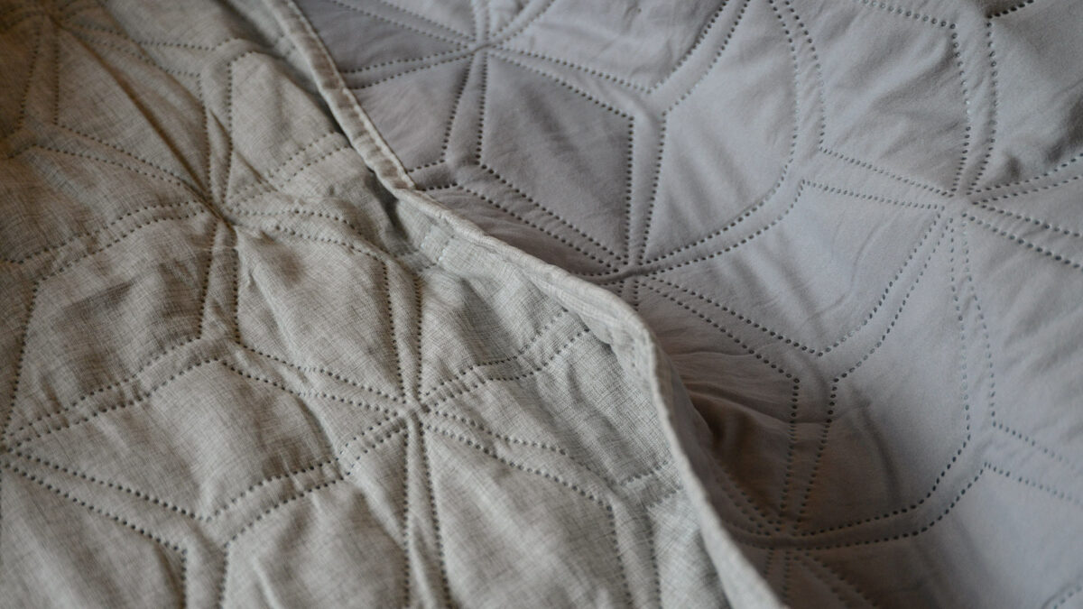 hexagonal quilted bedspread detail