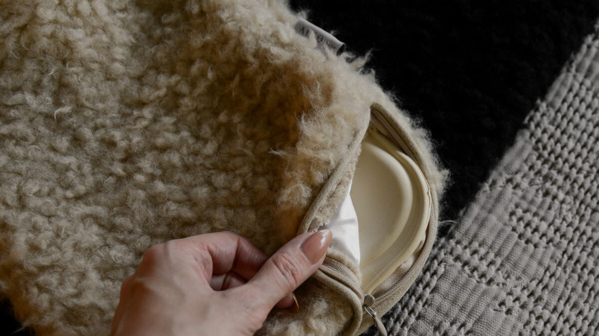 hot water bottle with easy to remove faux sheepskin cover