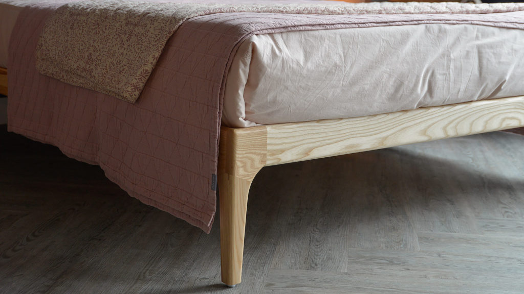 A closer view of the wooden Hoxton Bed leg made from Ash wood.