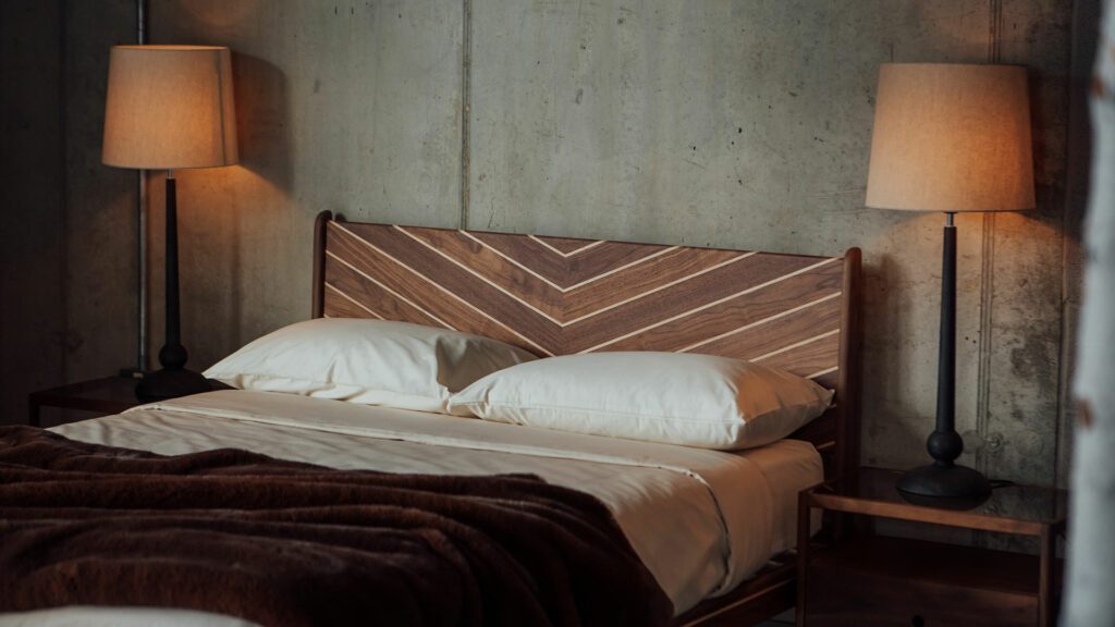 Hand-made in Britain our Special edition Hoxton bed with chevron patten headboard in walnut and maple.