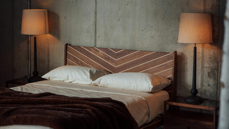 Hand-made in Britain our Special edition Hoxton wooden bed frame with chevron patten headboard in walnut and maple.