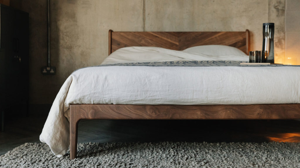 Hoxton bed in solid walnut with linen bedding