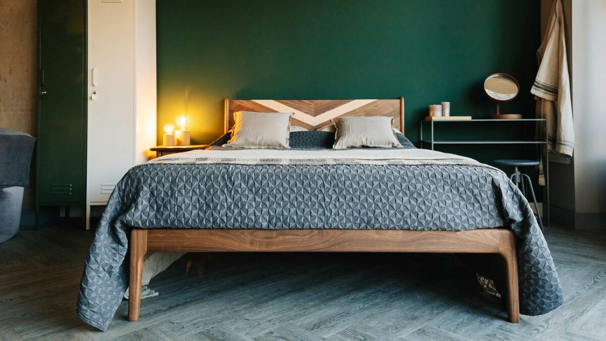 chevron inlaid walnut Hoxton bed shown from the foot end