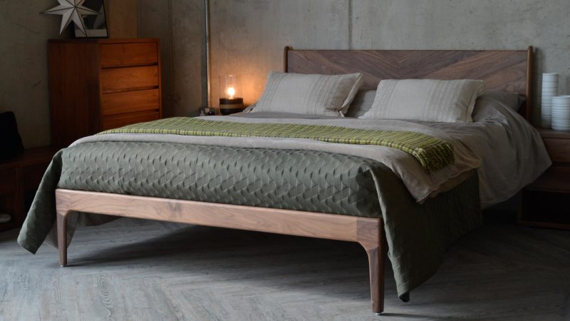 Hoxton contemporary wooden bed with striking chevron headboard and made in Walnut.