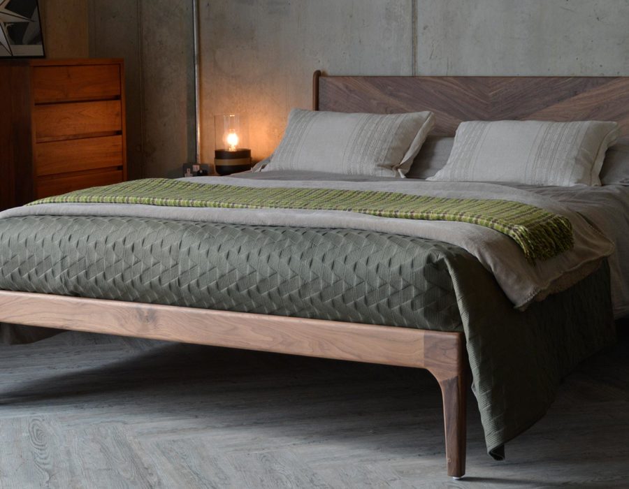 Hoxton contemporary wooden bed with striking chevron headboard and made in Walnut.