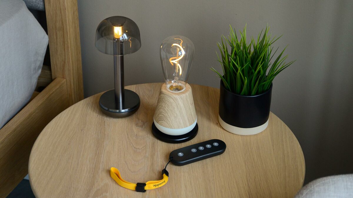 Chargeable portable Humble lamps shown with wireless charging deck and remote control