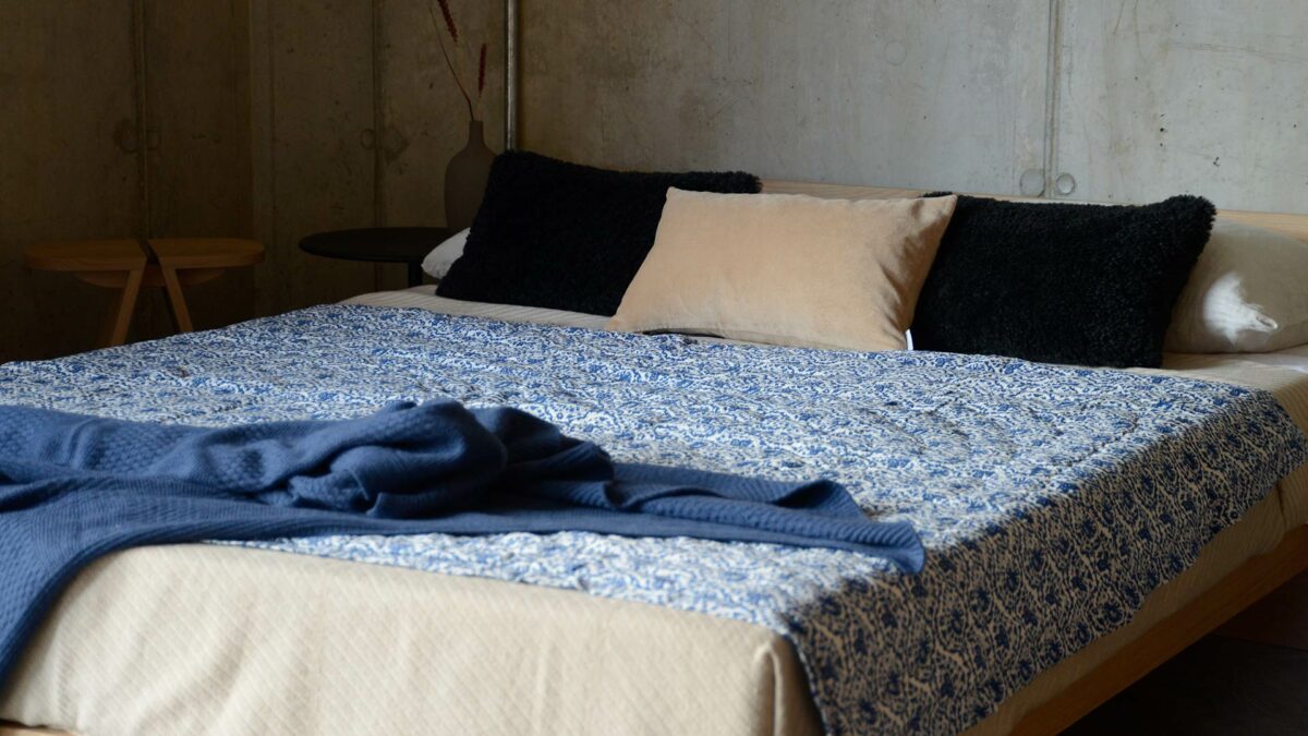 indigo blue block print patterned quilt