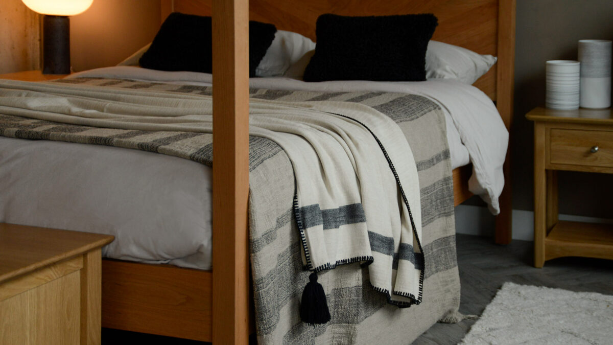 ivory and black throw with large black tassle detail