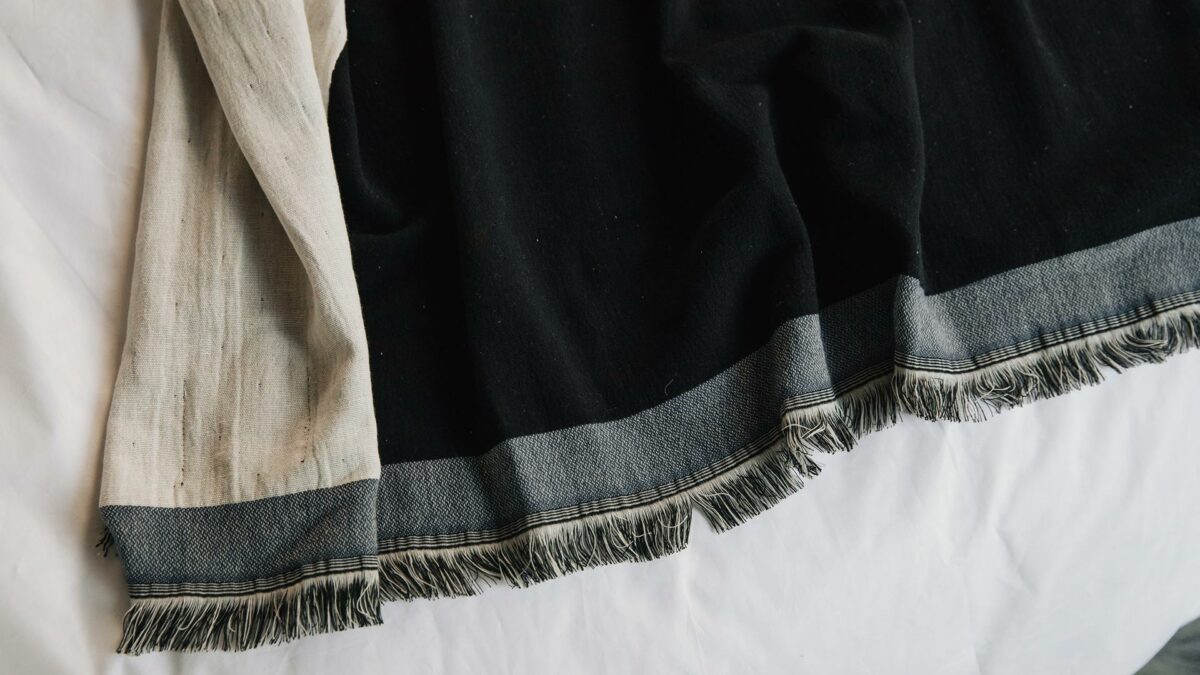 ivory and black throw with navy edge