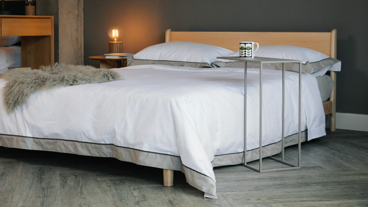 ivory and taupe bedding on Pimlico bed with mid grey table
