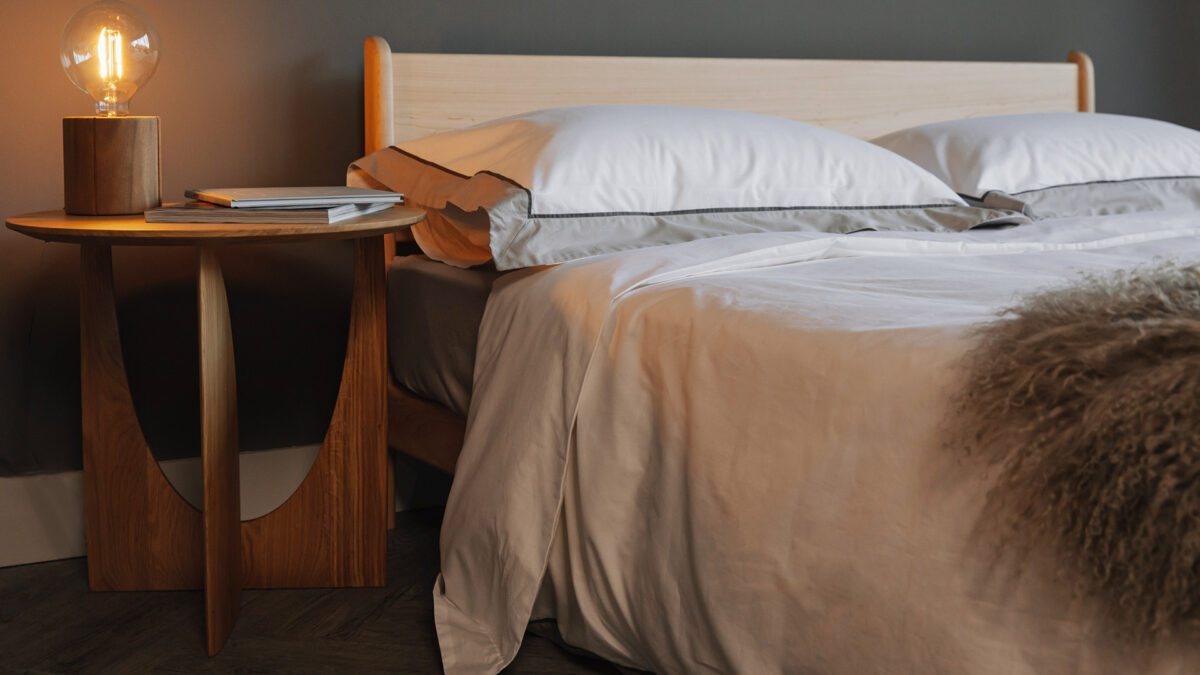ivory and taupe bedding on pimlico with geometric table