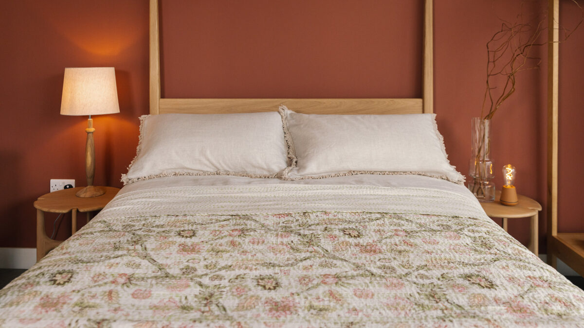 ivory floral kantha throw with linen bedding