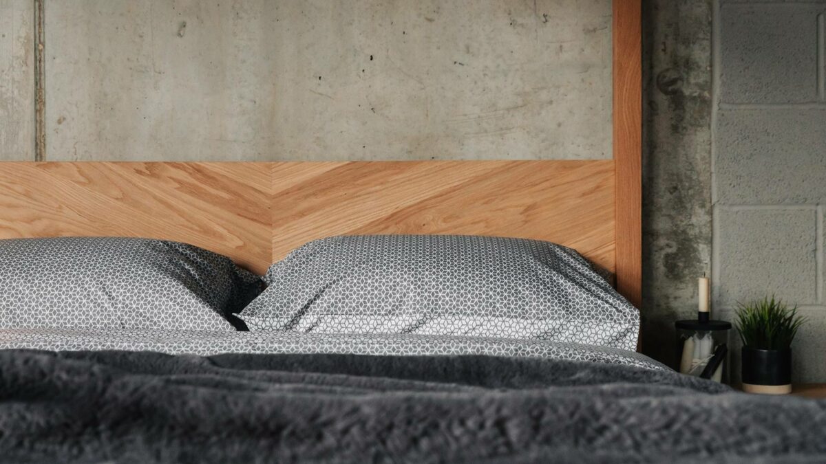 The headboard of our solid wood hand made Kelham 4 poster bed has a chevron pattern