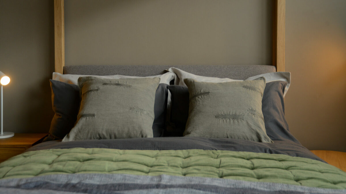 khaki cushions with embroidered look detail