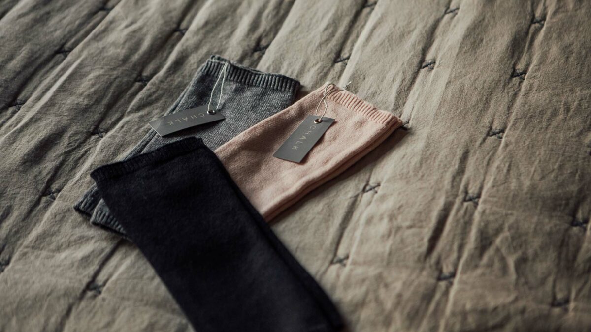 knitted wrist warmers in blush grey or black