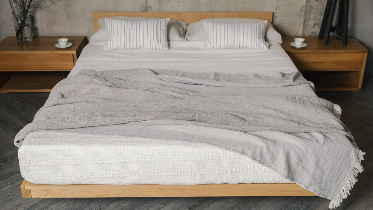 kumo bed in oak with organic cotton crinkle throw