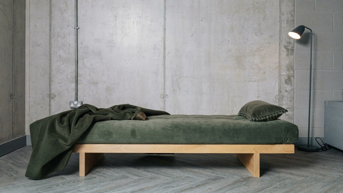 solid oak kyoto day bed with sprung mattress in olive green shown side on