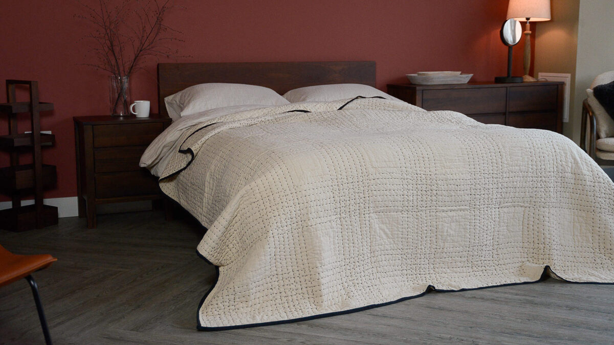 large embroided bedspread on smoked walnut malabar