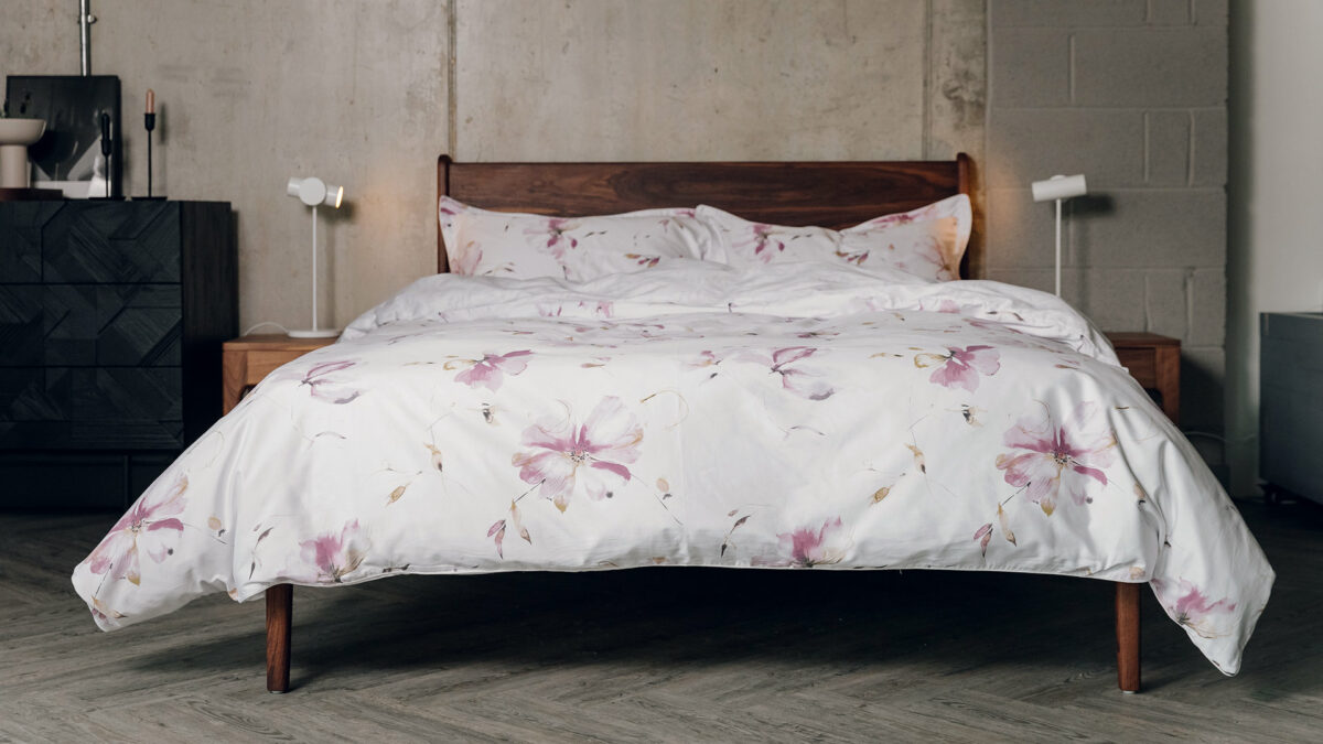soft pinks floral print duvet cover set shown on a kingsize bed