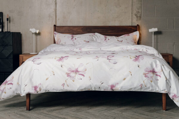 soft pinks floral print duvet cover set shown on a kingsize bed