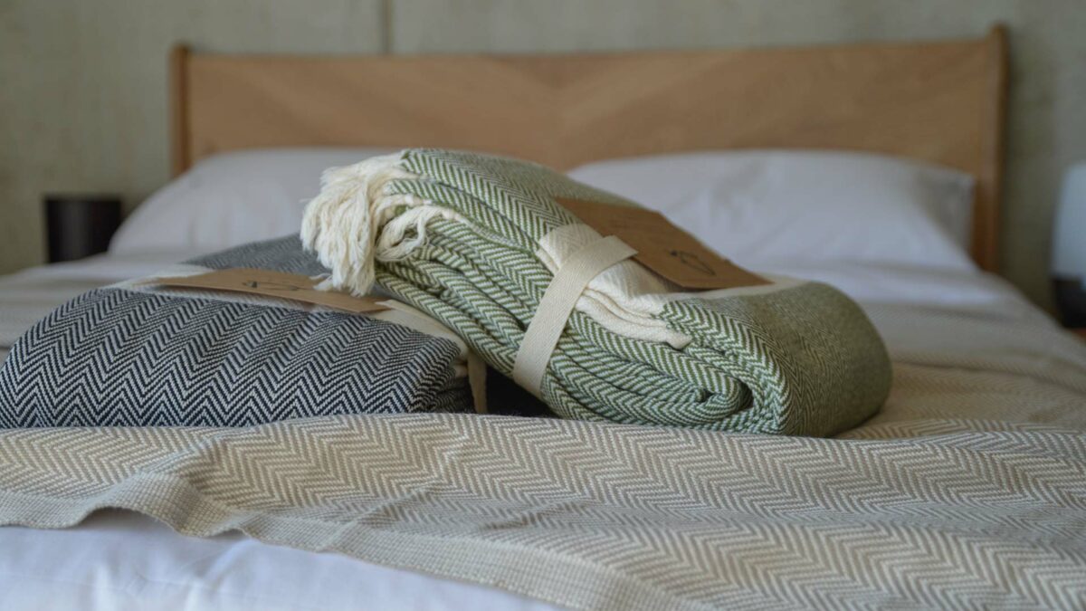 ethically made woven cotton blankets with herringbone weave and in 3 colour options