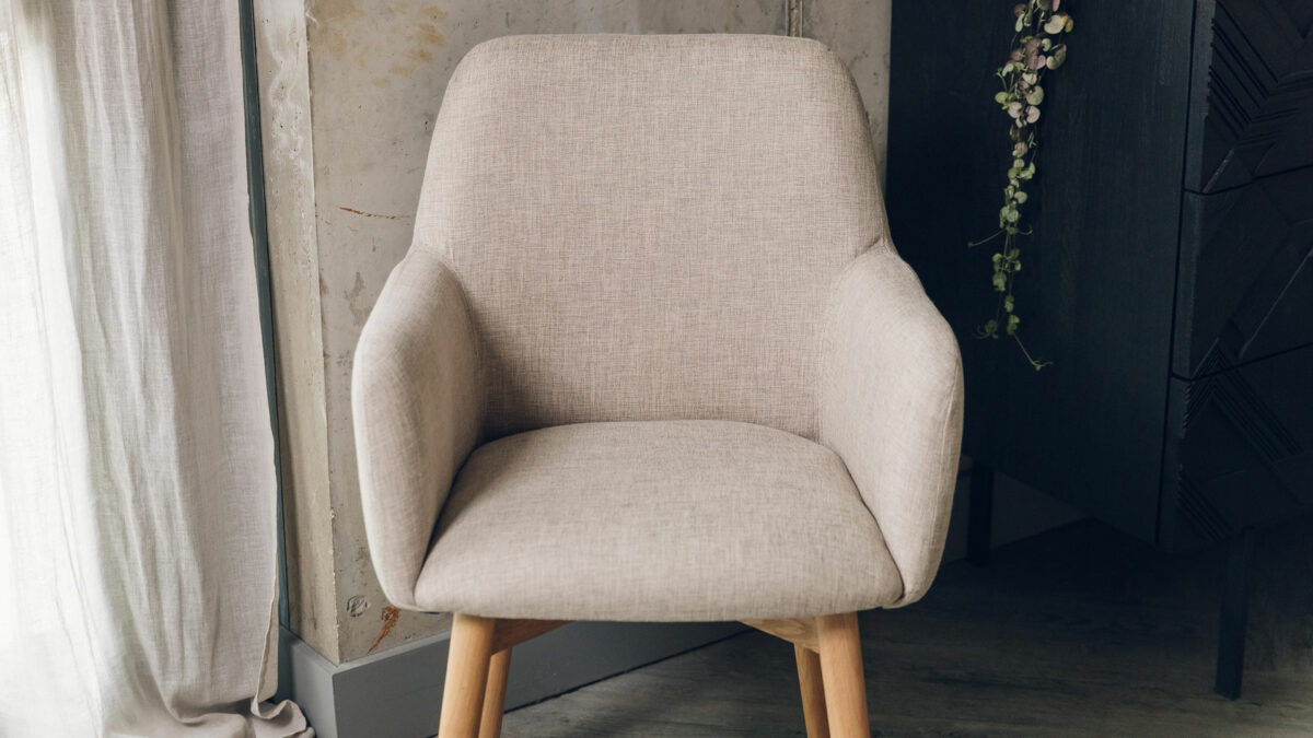 lauren chair with wooden legs and a sand coloured upholstery fabric