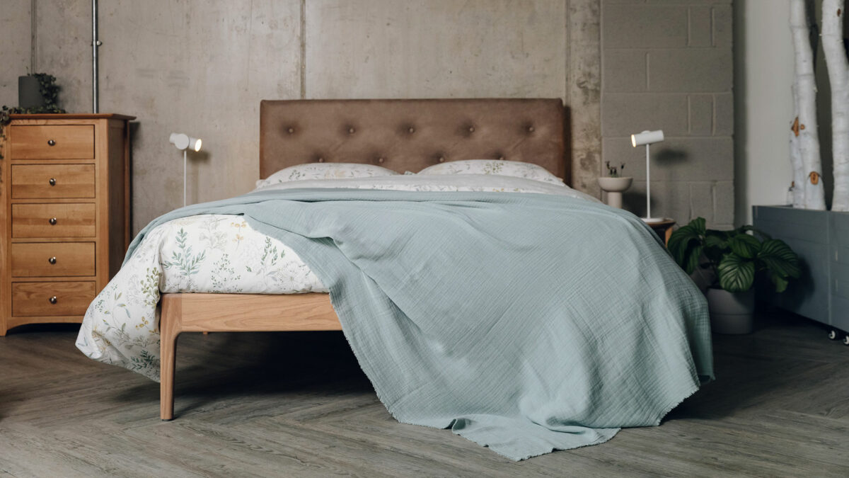 light summer weight bedspread in a muted aqua colour shown on our Bloomsbury bed